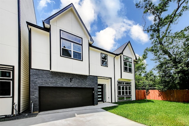 1913 Hoskins Dr Unit F, Houston, TX 77080 - view of front of property featuring stone siding, concrete driveway, and an attached garage