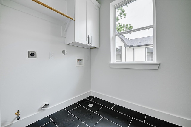 1913 Hoskins Dr Unit F, Houston, TX 77080 - laundry area featuring cabinet space, hookup for an electric dryer, washer hookup, baseboards, and dark tile patterned floors