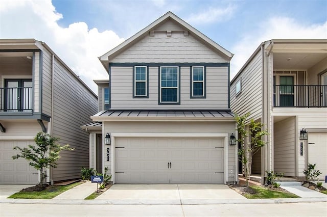 3421 Avondale View Dr, Houston, TX 77025 - view of front of property featuring a standing seam roof, a garage, metal roof, and driveway
