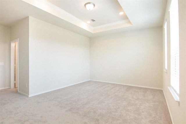 3421 Avondale View Dr, Houston, TX 77025 - empty room with light colored carpet, baseboards, crown molding, a raised ceiling, and recessed lighting