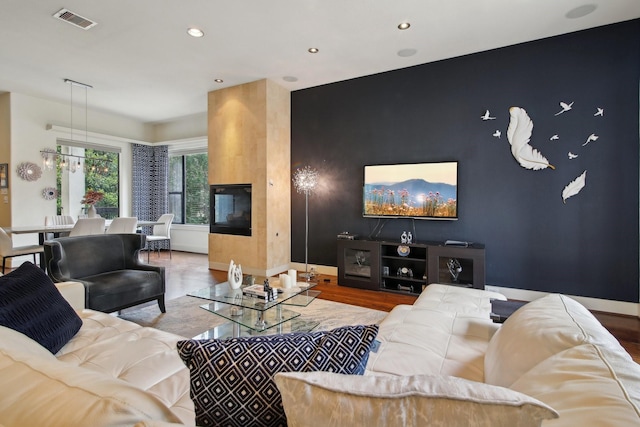 4129 Dickson St, Houston, TX 77007 - living area with wood finished floors, recessed lighting, and baseboards