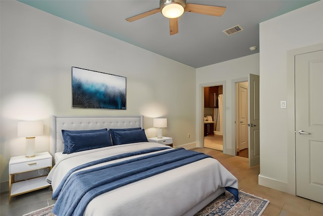 4129 Dickson St, Houston, TX 77007 - bedroom featuring baseboards, ceiling fan, ensuite bath, and light tile patterned flooring