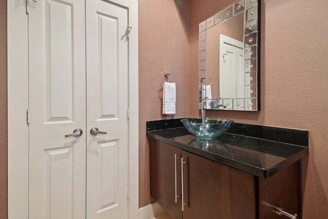 4129 Dickson St, Houston, TX 77007 - bathroom with vanity and a textured wall