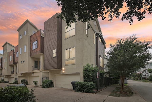 4129 Dickson St, Houston, TX 77007 - view of property featuring an attached garage and concrete driveway