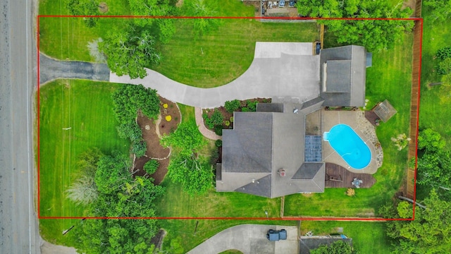 1207 W Edgewood Dr, Friendswood, TX 77546 - aerial view of property and surrounding area with a pool area and property parcel outlined