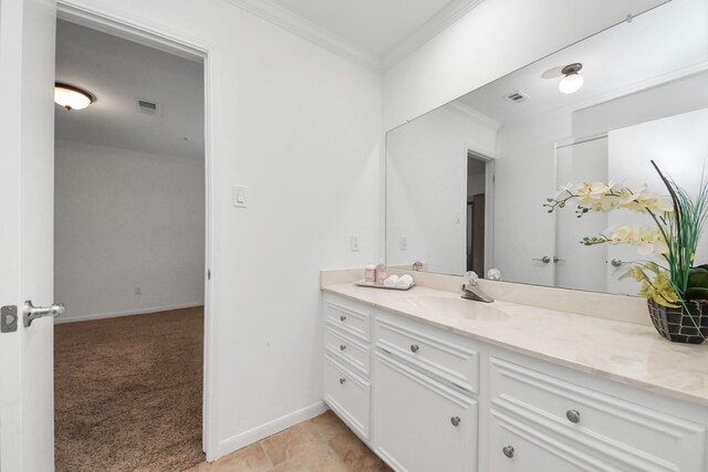 1207 W Edgewood Dr, Friendswood, TX 77546 - bathroom with crown molding, vanity, and baseboards