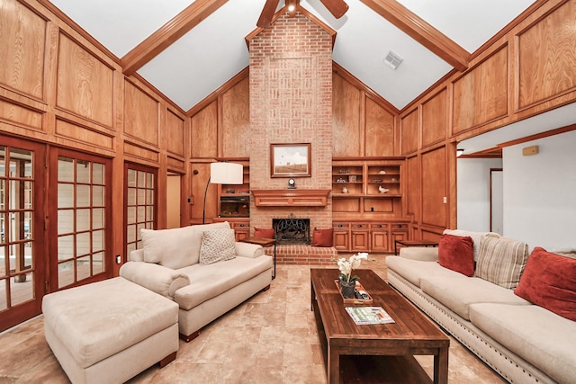 1207 W Edgewood Dr, Friendswood, TX 77546 - living room with high vaulted ceiling, wood walls, french doors, ceiling fan, and a fireplace