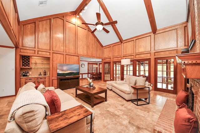 1207 W Edgewood Dr, Friendswood, TX 77546 - living room featuring high vaulted ceiling, french doors, a ceiling fan, a brick fireplace, and beamed ceiling
