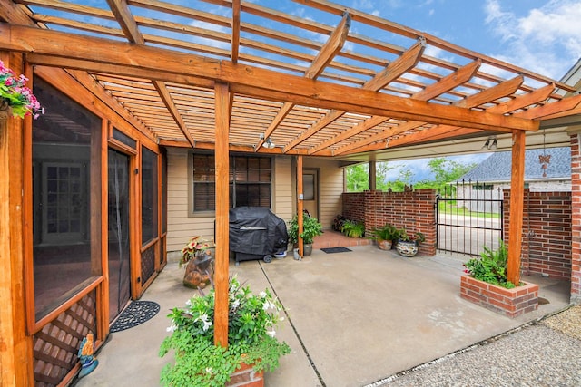 1207 W Edgewood Dr, Friendswood, TX 77546 - view of patio featuring grilling area, a pergola, and a gate