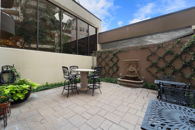 3525 Sage Rd Unit 1104, Houston, TX 77056 - view of patio with outdoor dining area