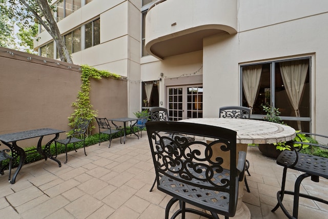 3525 Sage Rd Unit 1104, Houston, TX 77056 - view of patio featuring outdoor dining area