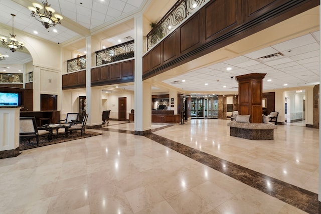 3525 Sage Rd Unit 1104, Houston, TX 77056 - community lobby featuring crown molding and a towering ceiling