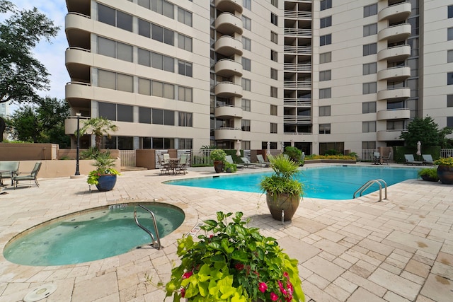 3525 Sage Rd Unit 1104, Houston, TX 77056 - community pool with a patio area
