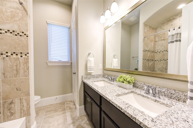 28907 Copper Break Ct, Katy, TX 77494 - full bath featuring double vanity, a tile shower, toilet, and baseboards