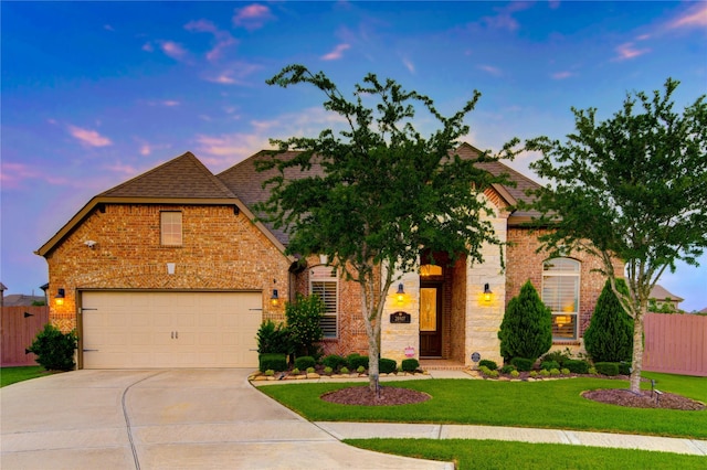 28907 Copper Break Ct, Katy, TX 77494 - view of front of house with driveway, brick siding, a shingled roof, and an attached garage