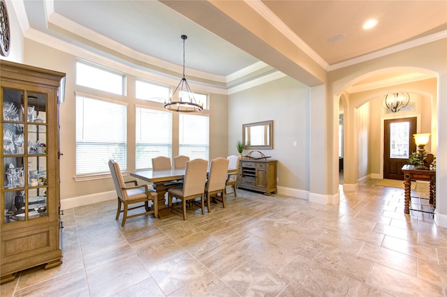 28907 Copper Break Ct, Katy, TX 77494 - dining room with a chandelier, arched walkways, baseboards, and crown molding