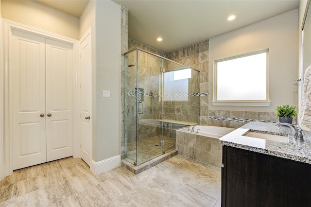 28907 Copper Break Ct, Katy, TX 77494 - bathroom with a garden tub, a stall shower, recessed lighting, vanity, and baseboards