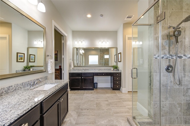 28907 Copper Break Ct, Katy, TX 77494 - bathroom with a shower stall, two vanities, and tile patterned flooring