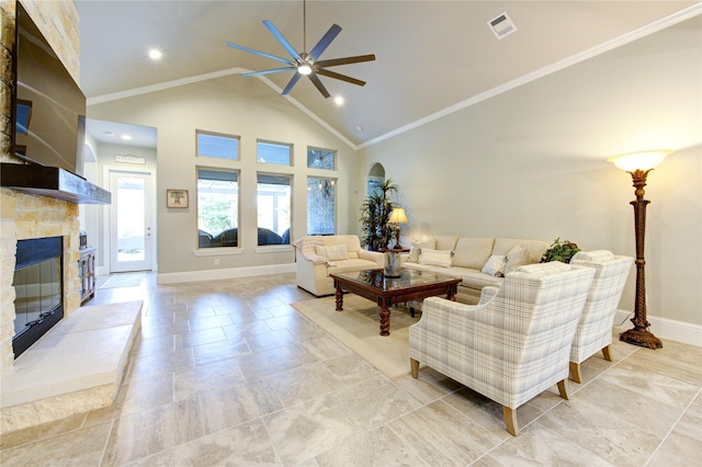 28907 Copper Break Ct, Katy, TX 77494 - living room with ceiling fan, a stone fireplace, high vaulted ceiling, baseboards, and ornamental molding