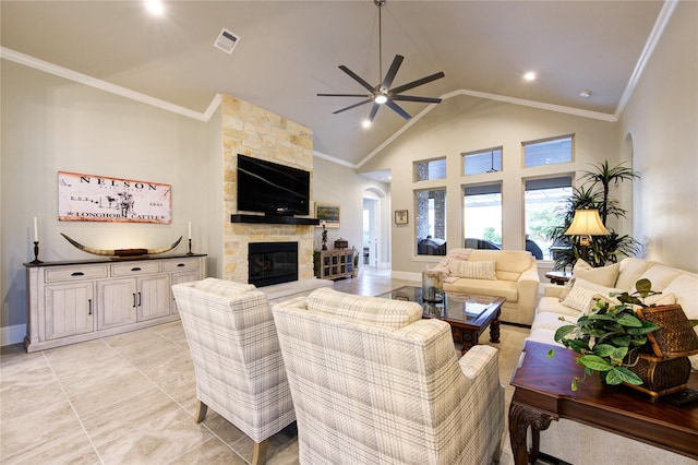 28907 Copper Break Ct, Katy, TX 77494 - living room featuring a ceiling fan, a fireplace, crown molding, baseboards, and high vaulted ceiling