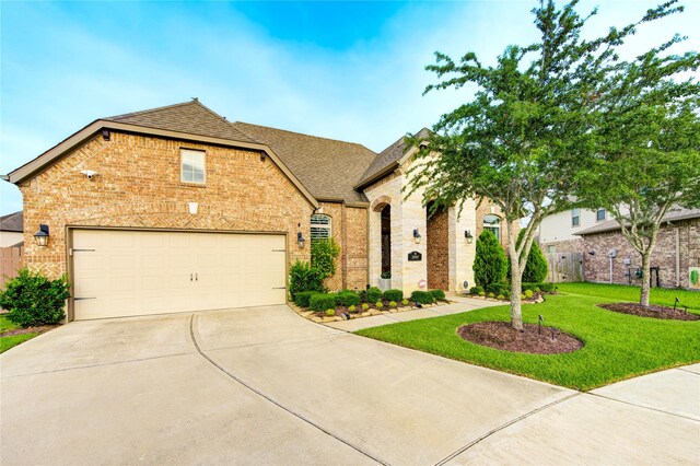 28907 Copper Break Ct, Katy, TX 77494 - view of front of house with brick siding, a shingled roof, and driveway