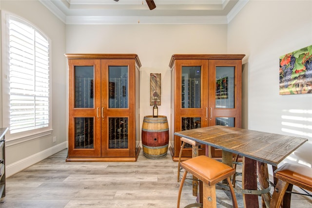 28907 Copper Break Ct, Katy, TX 77494 - dining space with ornamental molding, light wood finished floors, a ceiling fan, and plenty of natural light