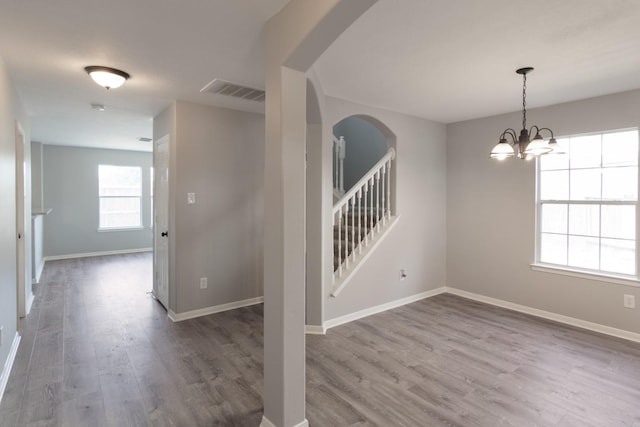 5903 Bonners Park Ct, Katy, TX 77449 - foyer entrance featuring arched walkways, wood finished floors, and baseboards