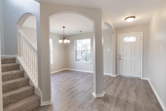 5903 Bonners Park Ct, Katy, TX 77449 - entrance foyer with wood finished floors, a chandelier, stairway, and baseboards
