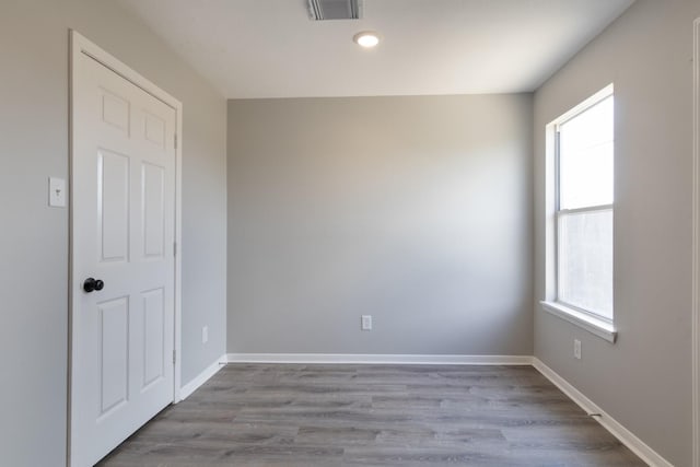 5903 Bonners Park Ct, Katy, TX 77449 - empty room with plenty of natural light, wood finished floors, recessed lighting, and baseboards