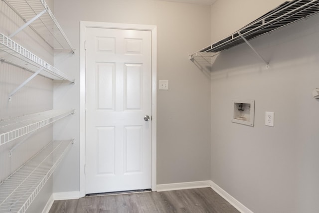 5903 Bonners Park Ct, Katy, TX 77449 - laundry room featuring washer hookup, wood finished floors, and baseboards