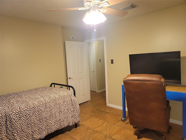 3501 Carson Ct, Pearland, TX 77584 - tiled bedroom featuring a ceiling fan, baseboards, and a desk