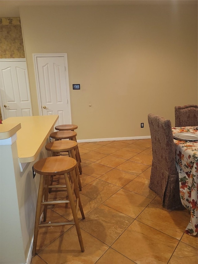 3501 Carson Ct, Pearland, TX 77584 - dining area featuring light tile patterned floors and baseboards