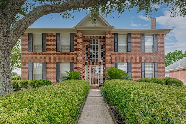 11203 Chestnut Woods Trl, Houston, TX 77065 - view of front of property with a chimney and brick siding