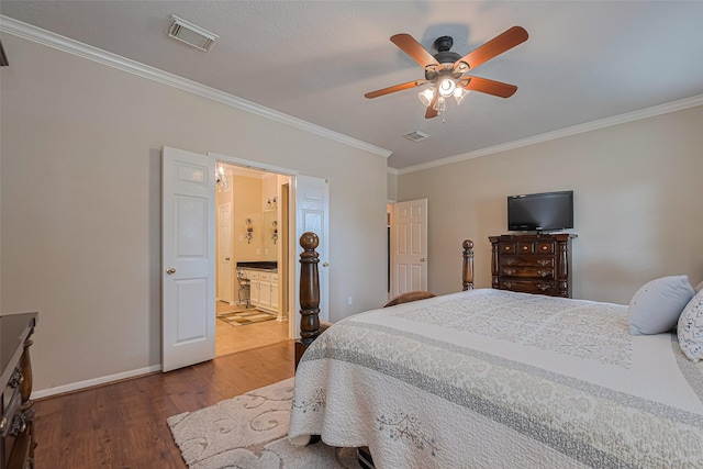 11203 Chestnut Woods Trl, Houston, TX 77065 - bedroom featuring dark wood finished floors, ornamental molding, baseboards, ensuite bathroom, and a ceiling fan