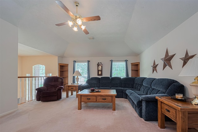11203 Chestnut Woods Trl, Houston, TX 77065 - living area featuring light carpet, ceiling fan, lofted ceiling, and a textured ceiling
