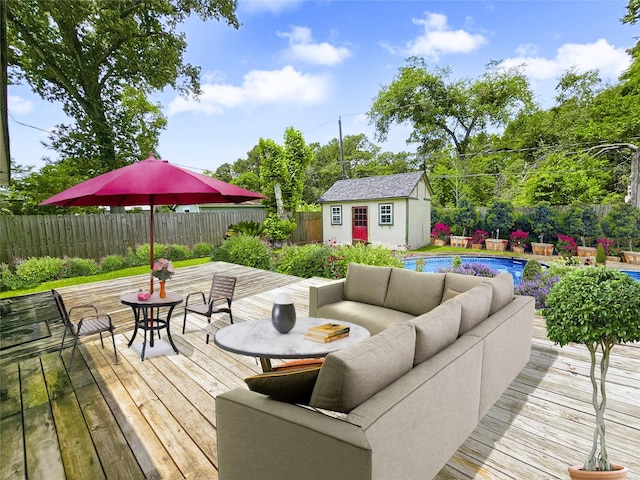 723 Pas Trl, Houston, TX 77336 - deck with outdoor lounge area, a fenced backyard, an outbuilding, and outdoor dining space