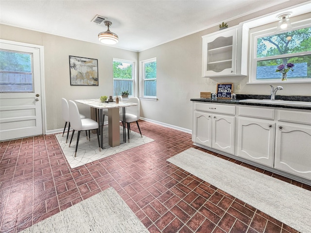 723 Pas Trl, Houston, TX 77336 - dining area with brick patterned floors and baseboards