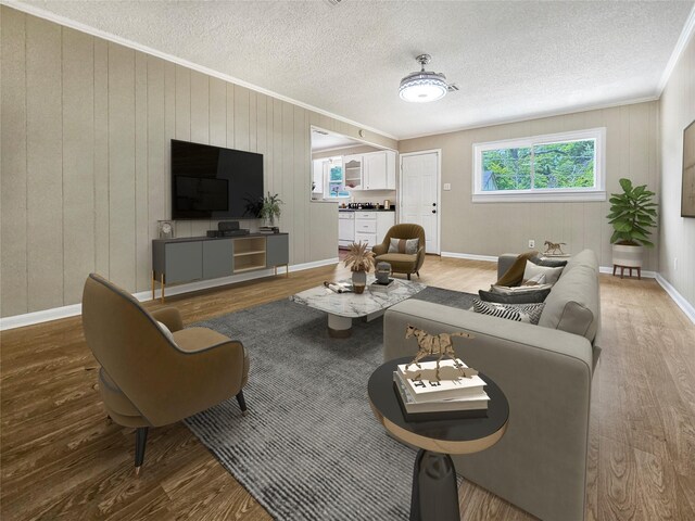 723 Pas Trl, Houston, TX 77336 - living area with ornamental molding, wood finished floors, a textured ceiling, and baseboards