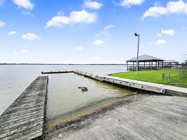 723 Pas Trl, Houston, TX 77336 - dock area with a boat ramp, a water view, a gazebo, and a yard