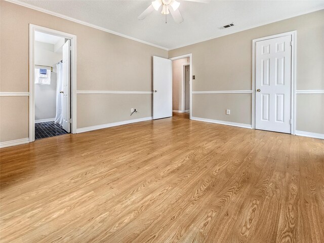 723 Pas Trl, Houston, TX 77336 - unfurnished bedroom with light wood-style floors, ceiling fan, baseboards, crown molding, and connected bathroom