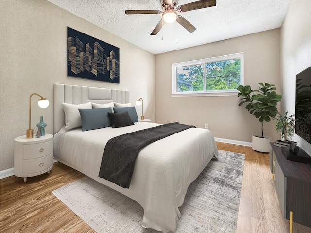 723 Pas Trl, Houston, TX 77336 - bedroom with wood finished floors, a textured ceiling, a ceiling fan, and baseboards