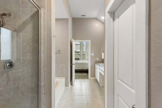 17102 Crimson Crest Dr, Conroe, TX 77302 - ensuite bathroom with a stall shower, tile patterned flooring, a garden tub, vanity, and vaulted ceiling