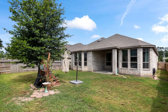 17102 Crimson Crest Dr, Conroe, TX 77302 - rear view of property with brick siding, a patio, and roof with shingles