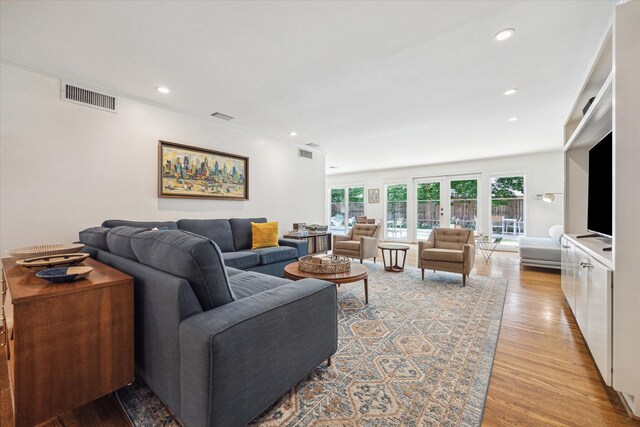 2415 Avalon Pl, Houston, TX 77019 - living room featuring light wood finished floors and recessed lighting