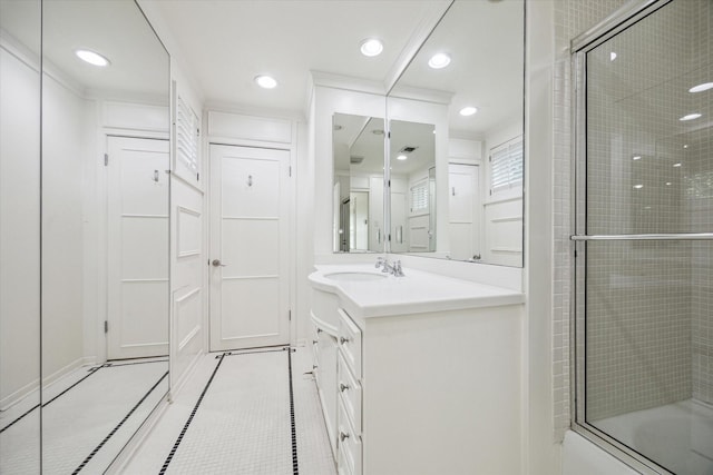 2415 Avalon Pl, Houston, TX 77019 - bathroom featuring vanity, bath / shower combo with glass door, recessed lighting, baseboards, and tile patterned flooring