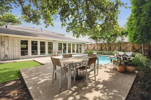 2415 Avalon Pl, Houston, TX 77019 - fenced backyard featuring a patio area and french doors