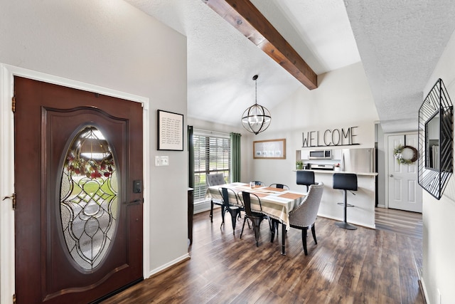 3808 Cottonwood Dr, La Porte, TX 77571 - entryway featuring dark wood-style flooring, a textured ceiling, a chandelier, and baseboards