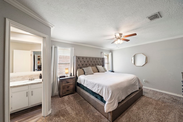 3808 Cottonwood Dr, La Porte, TX 77571 - bedroom featuring carpet floors, ornamental molding, baseboards, a ceiling fan, and a sink