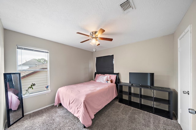 3808 Cottonwood Dr, La Porte, TX 77571 - bedroom with carpet flooring, a textured ceiling, ceiling fan, and baseboards