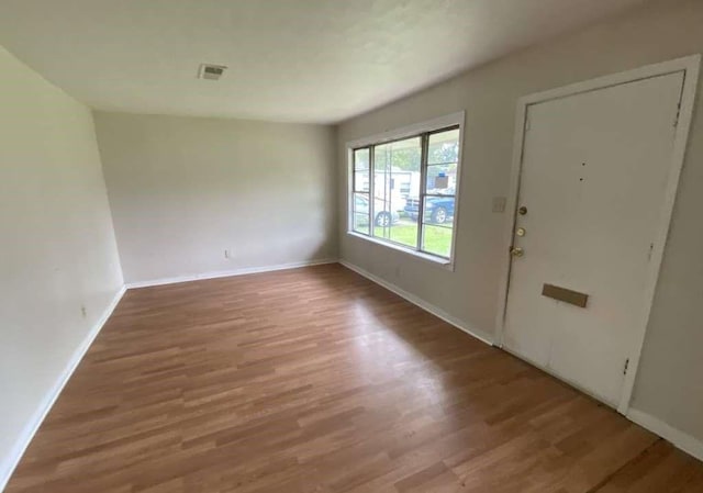 5715 Belmark St, Houston, TX 77033 - foyer with wood finished floors and baseboards
